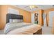 Comfortable bedroom with a large bed, ceiling fan, and ample closet space for a relaxing and organized living area at 1657 Stilesboro Ridge Dr, Kennesaw, GA 30152