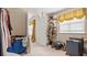 Small closet with clothes and other personal items at 1657 Stilesboro Ridge Dr, Kennesaw, GA 30152