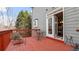 View from the deck of a gray two-story home with access to the interior and exterior at 1657 Stilesboro Ridge Dr, Kennesaw, GA 30152