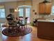 Inviting dining area with a circular rug, table setting for four, and French doors to the outside at 1657 Stilesboro Ridge Dr, Kennesaw, GA 30152