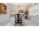 Formal dining room featuring elegant decor, wainscoting, and a chandelier at 1657 Stilesboro Ridge Dr, Kennesaw, GA 30152
