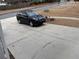 View of a car parked in the concrete driveway in front of the home at 1657 Stilesboro Ridge Dr, Kennesaw, GA 30152