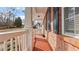 Charming front porch featuring red brick, white columns, and inviting rocking chairs at 1657 Stilesboro Ridge Dr, Kennesaw, GA 30152