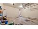 An empty garage with a refrigerator and an open door to the house at 1657 Stilesboro Ridge Dr, Kennesaw, GA 30152