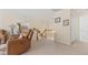 Open hallway leading to a bedroom featuring a pendant light and carpeted floor at 1657 Stilesboro Ridge Dr, Kennesaw, GA 30152
