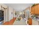 Spacious kitchen with a central island, wood floors, and modern appliances at 1657 Stilesboro Ridge Dr, Kennesaw, GA 30152