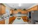 Spacious kitchen with wood cabinets, stainless steel appliances and a center island at 1657 Stilesboro Ridge Dr, Kennesaw, GA 30152