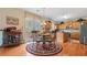 Bright kitchen with wood floors, an island, stainless steel appliances, and access to the deck at 1657 Stilesboro Ridge Dr, Kennesaw, GA 30152