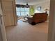 Spacious carpeted living room featuring a large window and comfortable seating at 1657 Stilesboro Ridge Dr, Kennesaw, GA 30152