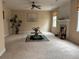 Bright living room featuring a ceiling fan, fireplace, and large artwork that adds a touch of elegance at 1657 Stilesboro Ridge Dr, Kennesaw, GA 30152