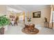 Elegant living room with a chandelier, flowers, artwork, and plush furnishings at 1657 Stilesboro Ridge Dr, Kennesaw, GA 30152