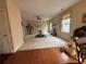 Spacious living room featuring hardwood floors, neutral walls, a cozy fireplace, and ample natural light at 1657 Stilesboro Ridge Dr, Kennesaw, GA 30152