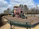A vibrant and inviting playground with a slide, climbing structure, and benches at 1657 Stilesboro Ridge Dr, Kennesaw, GA 30152