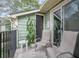 A cozy outdoor balcony with seating and a potted plant at 3205 Canyon Point Cir, Roswell, GA 30076