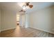 Spacious bedroom with ceiling fan, neutral paint, and laminate flooring at 3205 Canyon Point Cir, Roswell, GA 30076