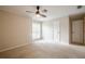 Neutral bedroom with a large window, standard closet and ceiling fan with lighting at 3205 Canyon Point Cir, Roswell, GA 30076