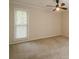 Spacious bedroom featuring neutral walls, carpet and a ceiling fan with lighting at 3205 Canyon Point Cir, Roswell, GA 30076