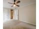 A bedroom featuring neutral walls, carpet and doors for the ensuite bathroom and closet at 3205 Canyon Point Cir, Roswell, GA 30076