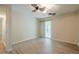 Bright bedroom with sliding glass door to a private balcony and an en-suite bathroom at 3205 Canyon Point Cir, Roswell, GA 30076