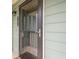 Close-up of unit door, dark frame, pane glass with matching handle, and green siding at 3205 Canyon Point Cir, Roswell, GA 30076
