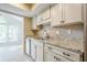 Open kitchen featuring granite countertops, stainless steel appliances, and bright breakfast room at 3205 Canyon Point Cir, Roswell, GA 30076