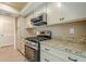 Modern kitchen with granite countertops, stainless steel appliances, and ample cabinet space at 3205 Canyon Point Cir, Roswell, GA 30076
