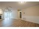 Open-concept living space with fireplace, modern flooring, and ample natural light from large windows at 3205 Canyon Point Cir, Roswell, GA 30076