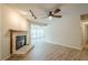 Bright living room featuring a fireplace and expansive windows for plenty of natural light at 3205 Canyon Point Cir, Roswell, GA 30076