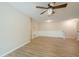 Open living space with modern flooring, ceiling fan and staircase at 3205 Canyon Point Cir, Roswell, GA 30076