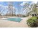 Community pool with a gazebo and sundeck surrounded by mature trees at 3205 Canyon Point Cir, Roswell, GA 30076