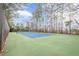 Community tennis court surrounded by mature trees at 3205 Canyon Point Cir, Roswell, GA 30076