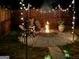 Cozy backyard seating area with inviting string lights, ideal for evening gatherings at 6048 Prodigy Ln, Locust Grove, GA 30248