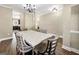 Elegant dining room with modern chandelier and large table at 6048 Prodigy Ln, Locust Grove, GA 30248