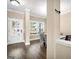 Bright entryway featuring wood floors and a view into the dining area at 6048 Prodigy Ln, Locust Grove, GA 30248