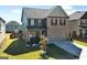 Two story home with well maintained lawn, grey siding, and dark shutters at 6048 Prodigy Ln, Locust Grove, GA 30248