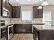 This kitchen features granite countertops, a microwave and stainless steel appliances at 6048 Prodigy Ln, Locust Grove, GA 30248