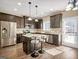 Well-lit kitchen features stainless steel appliances, granite countertops, and a convenient island with seating at 6048 Prodigy Ln, Locust Grove, GA 30248
