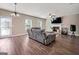 Cozy living room featuring a fireplace and a view of the backyard at 6048 Prodigy Ln, Locust Grove, GA 30248