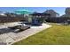 Backyard featuring an in-ground pool, patio area, a sun lounger, surrounded by lush greenery, and privacy fence at 6048 Prodigy Ln, Locust Grove, GA 30248