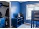 Blue bedroom featuring a bunk bed, dresser, window, and closet at 20 Cascade Ct, Covington, GA 30016