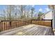 Spacious wooden deck overlooking a private backyard surrounded by mature trees at 2275 Perch Sw Way, Marietta, GA 30008
