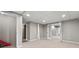Large basement space with multiple doorways, carpeted floor and neutral colored walls at 2275 Perch Sw Way, Marietta, GA 30008