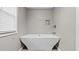 Modern bathroom featuring a standalone tub, faucet fixtures, and an alcove shelf at 2275 Perch Sw Way, Marietta, GA 30008