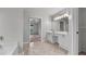 Well-lit bathroom with double vanity, tile flooring, and separate tub and shower areas at 2275 Perch Sw Way, Marietta, GA 30008