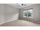 Bedroom with carpeted floors and a window that offers ample natural light at 2275 Perch Sw Way, Marietta, GA 30008