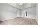 Spacious bedroom featuring neutral walls, plush carpeting, and a double door closet at 2275 Perch Sw Way, Marietta, GA 30008