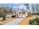 Charming two-story home featuring a brick and stucco facade with a well-manicured front yard and a two-car garage at 2275 Perch Sw Way, Marietta, GA 30008