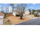 Spacious two-story home with brick accents, a well-kept lawn, and a newly constructed wooden fence at 2275 Perch Sw Way, Marietta, GA 30008