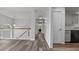 Hallway with hardwood floors, a wooden banister, and gray walls at 2275 Perch Sw Way, Marietta, GA 30008