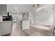 Open-concept kitchen and living area with stainless steel appliances, light cabinets, and a seamless flow for entertaining at 2275 Perch Sw Way, Marietta, GA 30008
